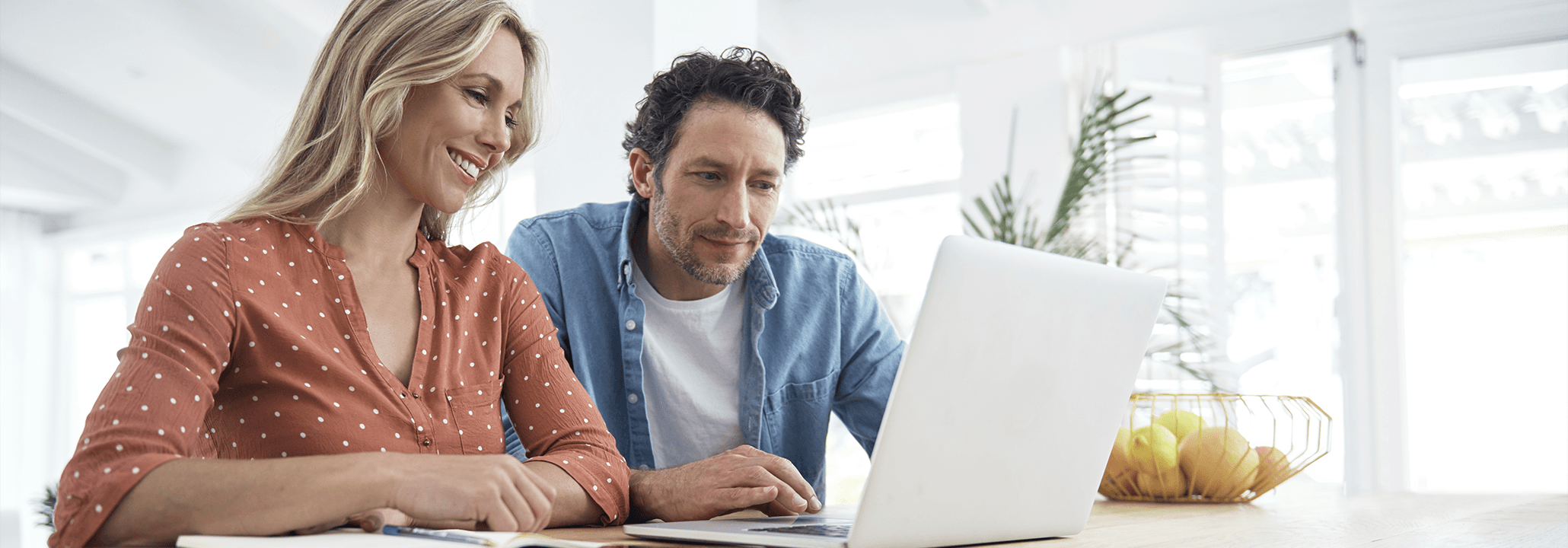 Customer Service Understanding Bill a woman using a laptop sitting next to a man