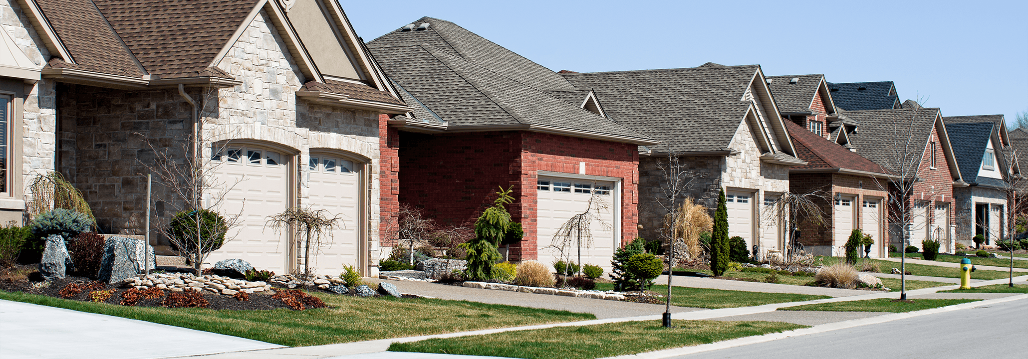 Neighborhood Cross Bore safety Image of the front of several houses on a residential street